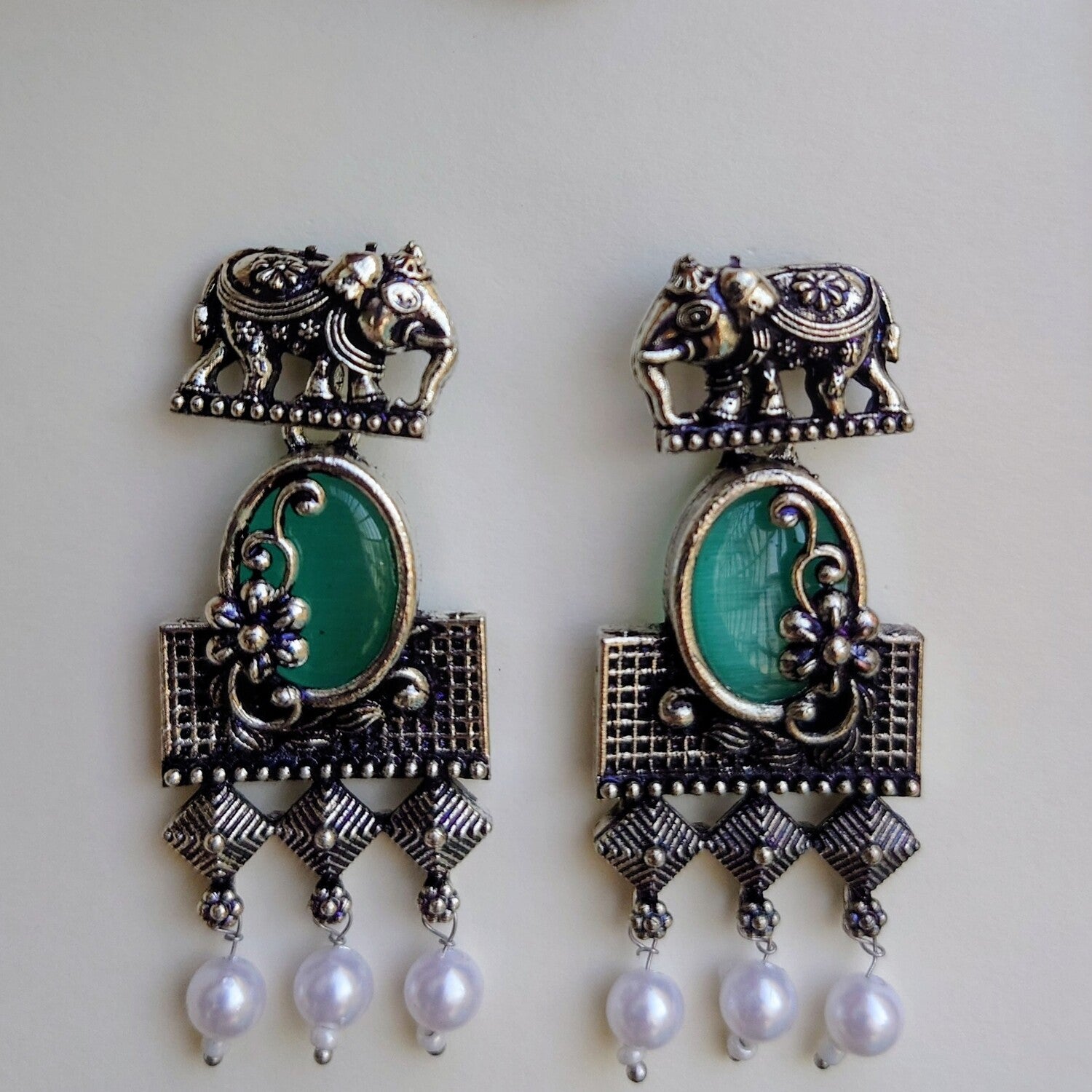 Green stone with elephant studearrings