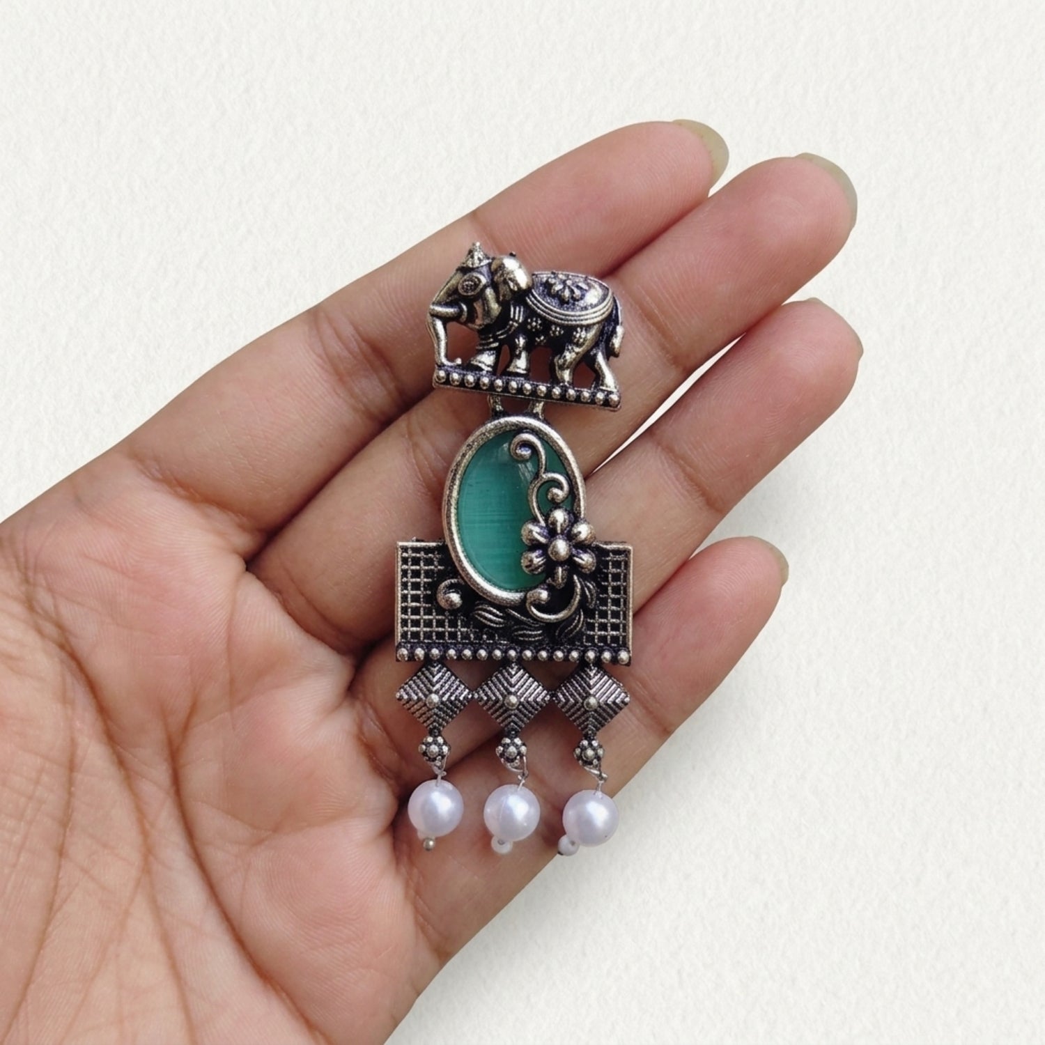 Green stone with elephant studearrings
