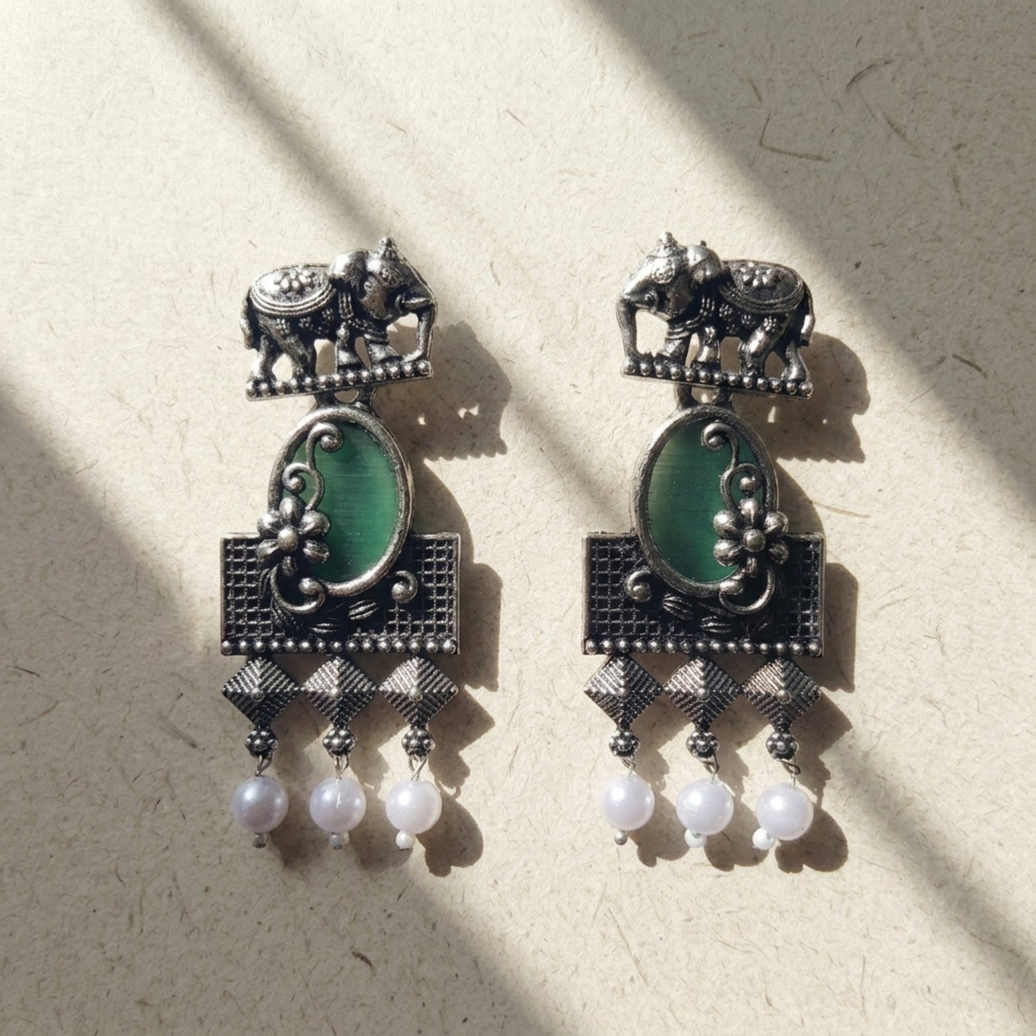 Green stone with elephant studearrings